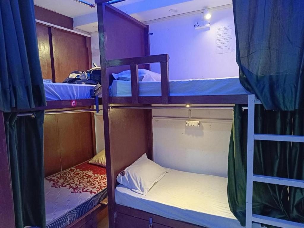 Ένα ή περισσότερα κρεβάτια σε δωμάτιο στο New Frezon hostel