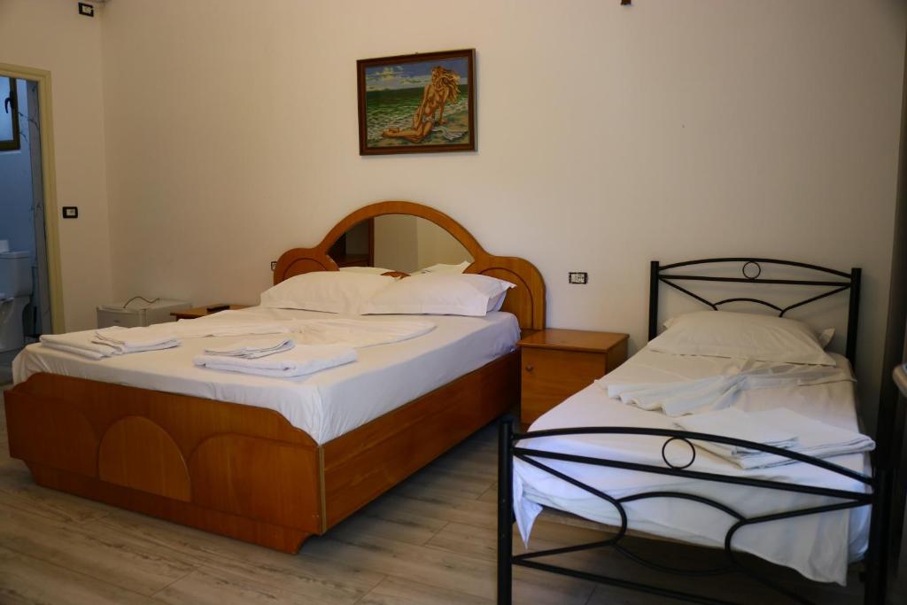 Postel nebo postele na pokoji v ubytování Hotel Vila Stefa