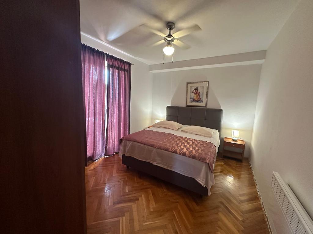 Postel nebo postele na pokoji v ubytování Apartments Iva