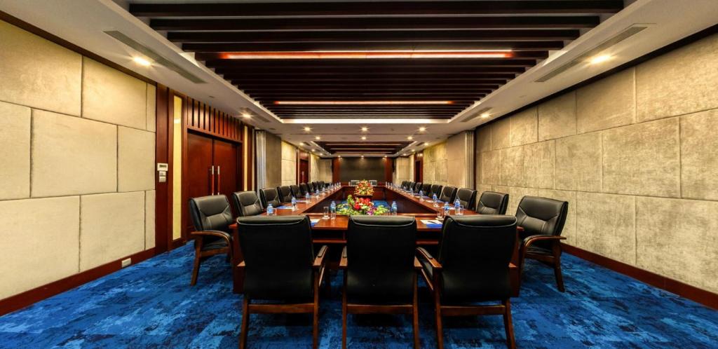a large conference room with a long table and chairs at Boton Blue Hotel & Spa in Nha Trang