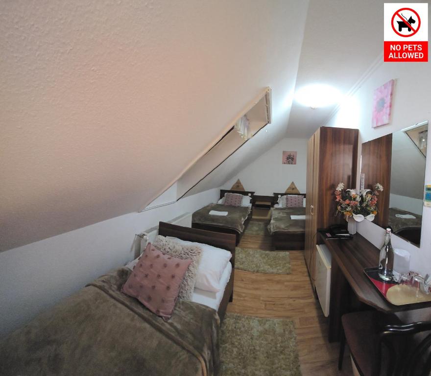 Postel nebo postele na pokoji v ubytování Le Rose Suites & Park Hotel