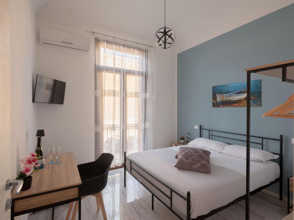 Postel nebo postele na pokoji v ubytování Agorà di Favignana