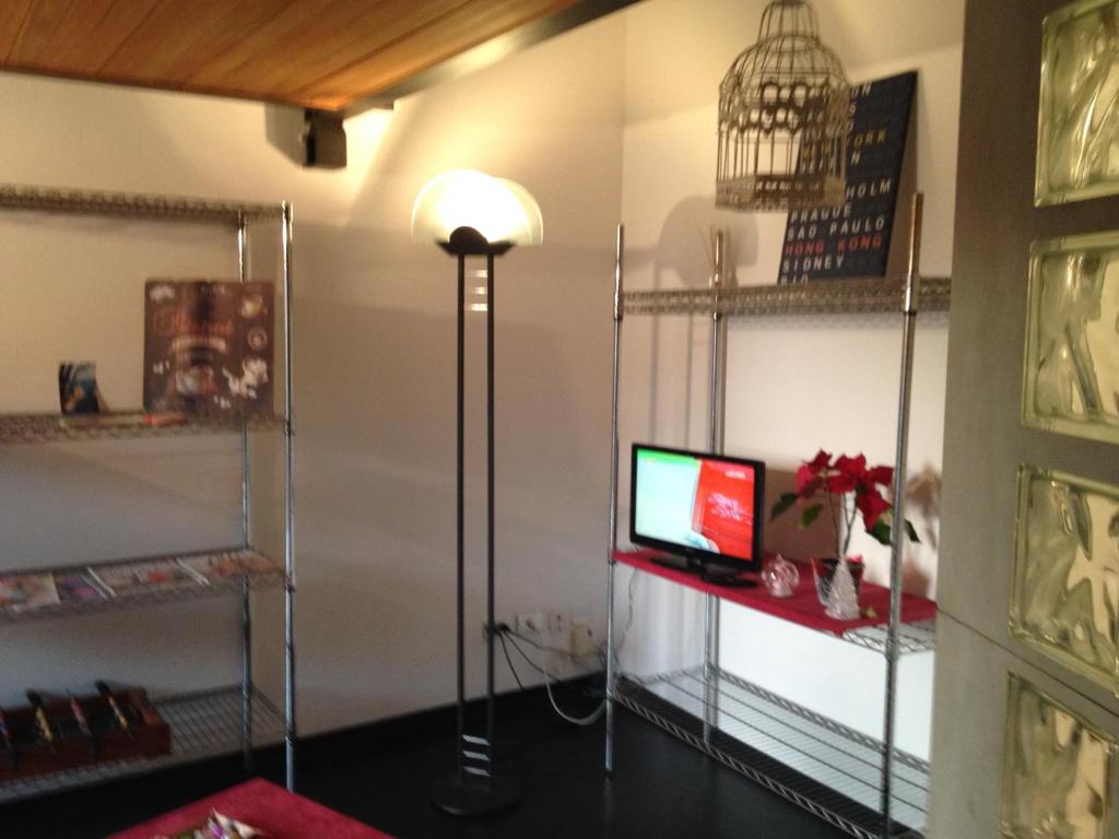 Televízia a/alebo spoločenská miestnosť v ubytovaní Romeo and Juliet Apartaments