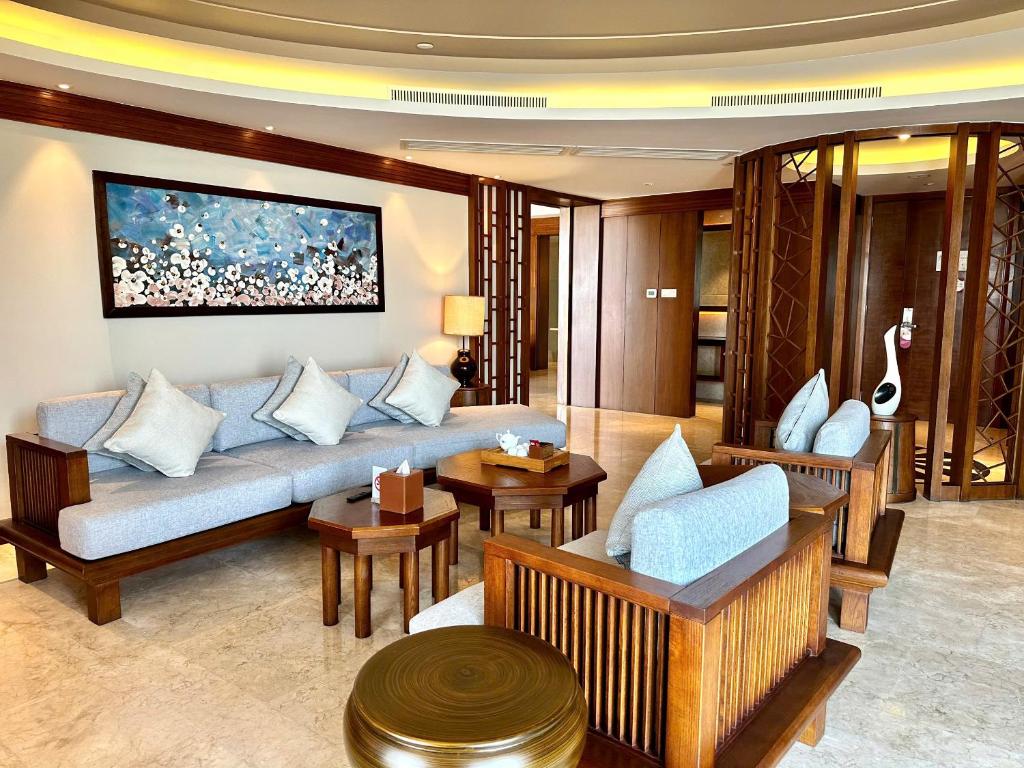 A formal lounge offers ample upholstered seating around low tables.