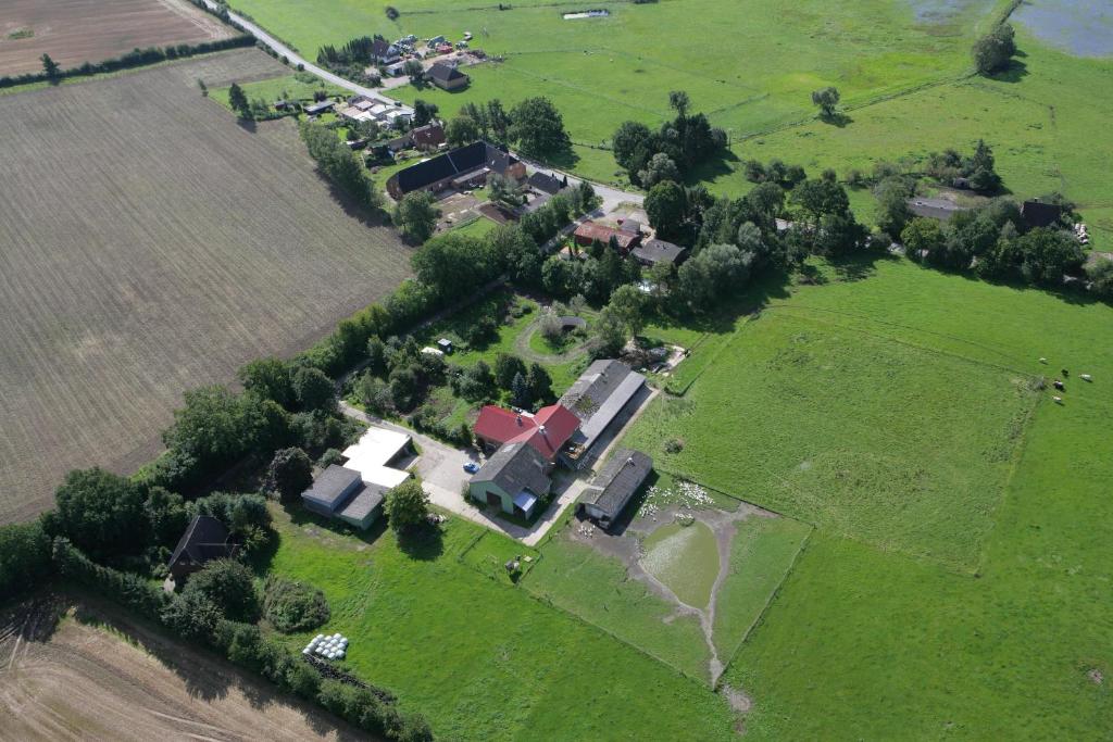 an aerial view of a house in a field at Hof Beuck in Travenhorst