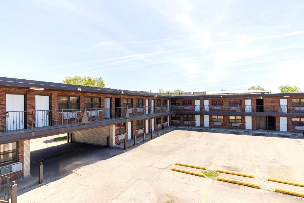 an exterior view of a building with a large patio at Admiral Motel By OYO Chicago I-94 in Chicago