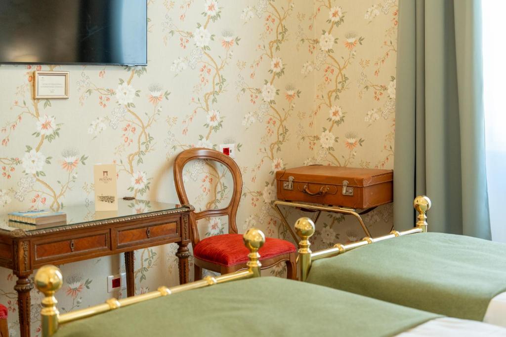 Postel nebo postele na pokoji v ubytování Hotel Pendini
