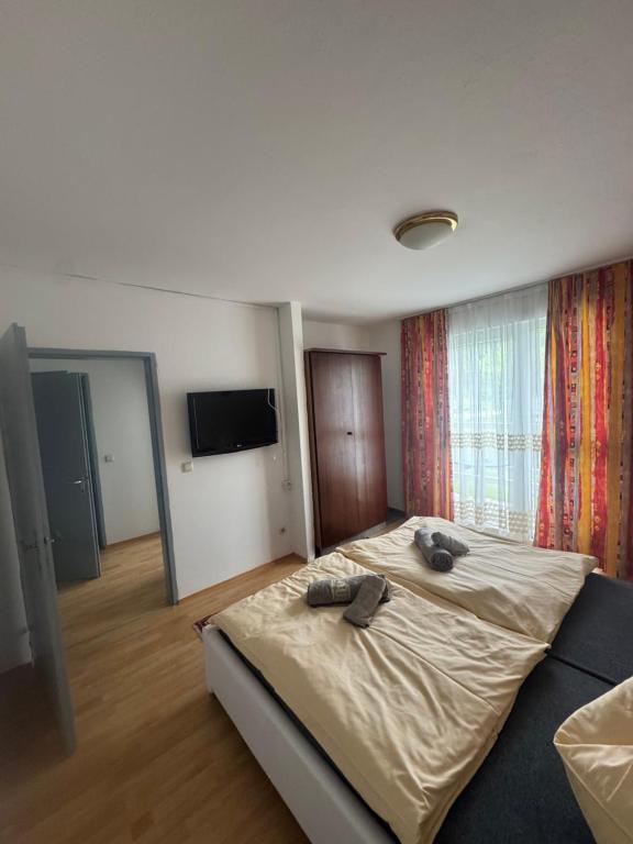 Postel nebo postele na pokoji v ubytování Guesthouse-Mother