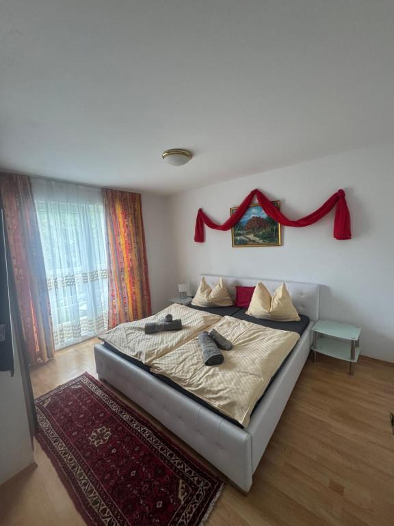 Postel nebo postele na pokoji v ubytování Guesthouse-Mother