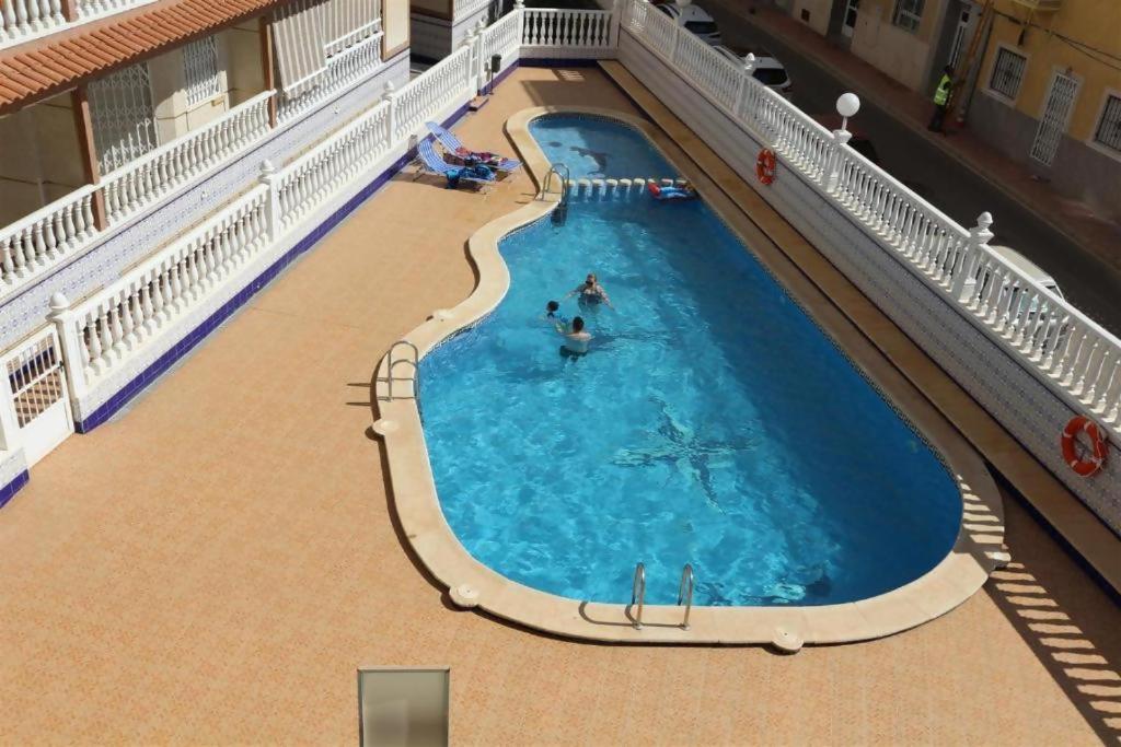 Bazén v ubytování R-5080 La Mata Apartment nebo v jeho okolí