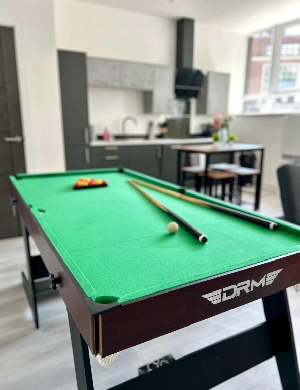 a pool table in an office with afits at Hull NEW Central Apartment 15 UNITS AVAILABLE in Hull