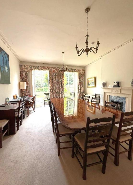 a dining room with a table and chairs at East Pallant Bed and Breakfast, Located in Large Georgian Townhouse in Central Chichester in Chichester