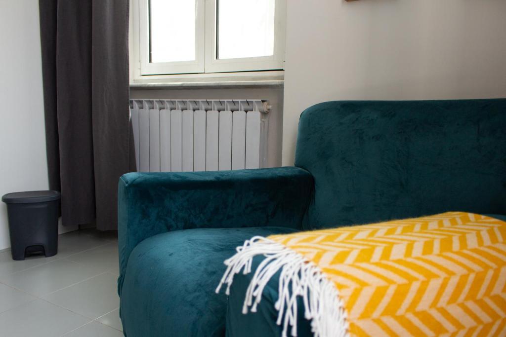 Posezení v ubytování Caligo B&B stanza privata in villa d'epoca con giardino e vista mare