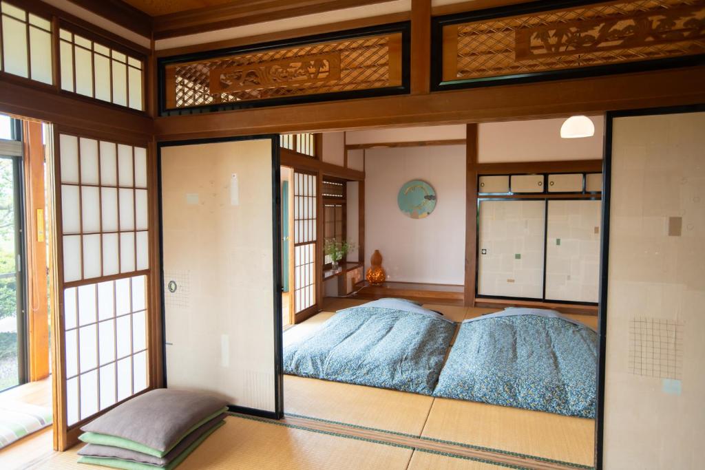 Postel nebo postele na pokoji v ubytování こだまやリトリート 女性専用 women-only