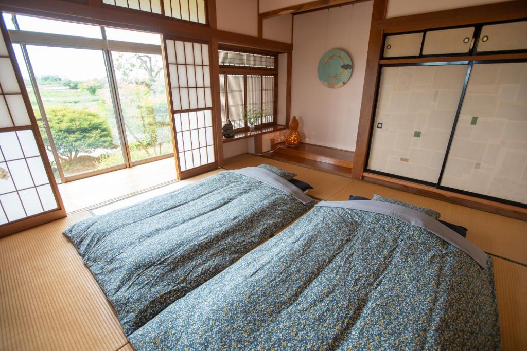 Postel nebo postele na pokoji v ubytování こだまやリトリート 女性専用 women-only