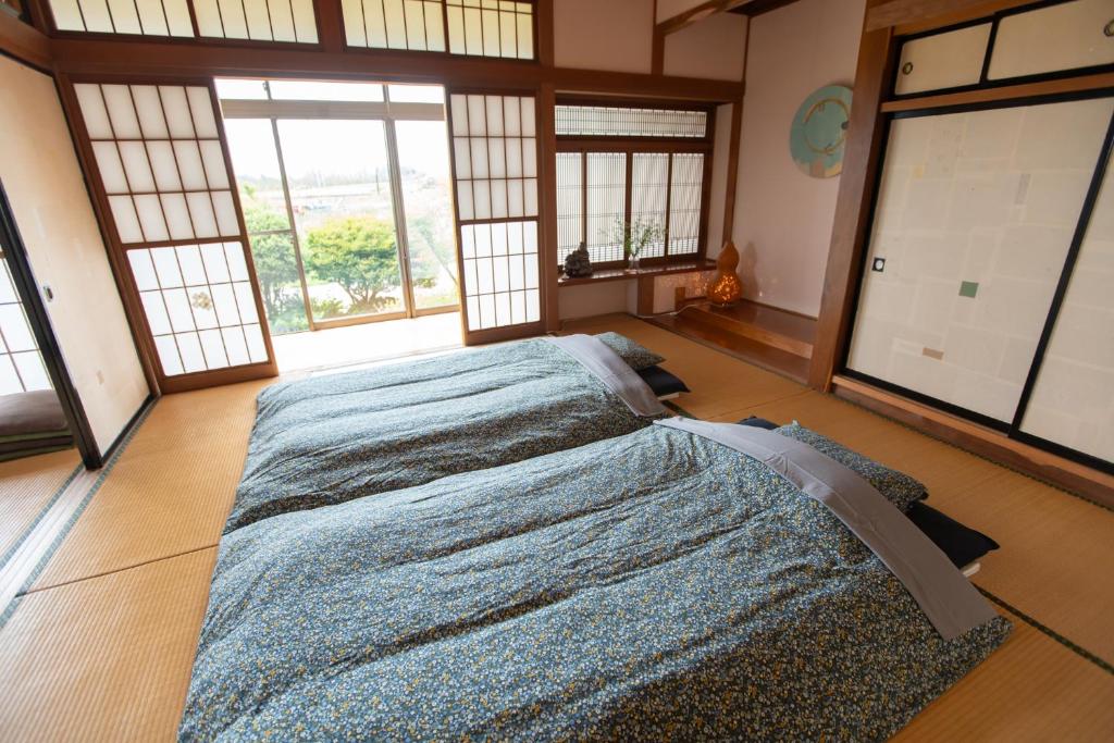 Postel nebo postele na pokoji v ubytování こだまやリトリート 女性専用 women-only