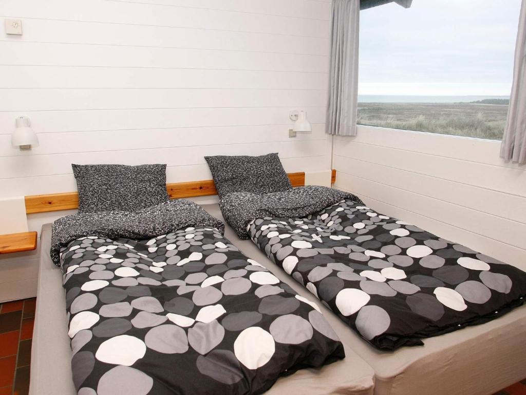 Postel nebo postele na pokoji v ubytování Vigsø Holiday Center
