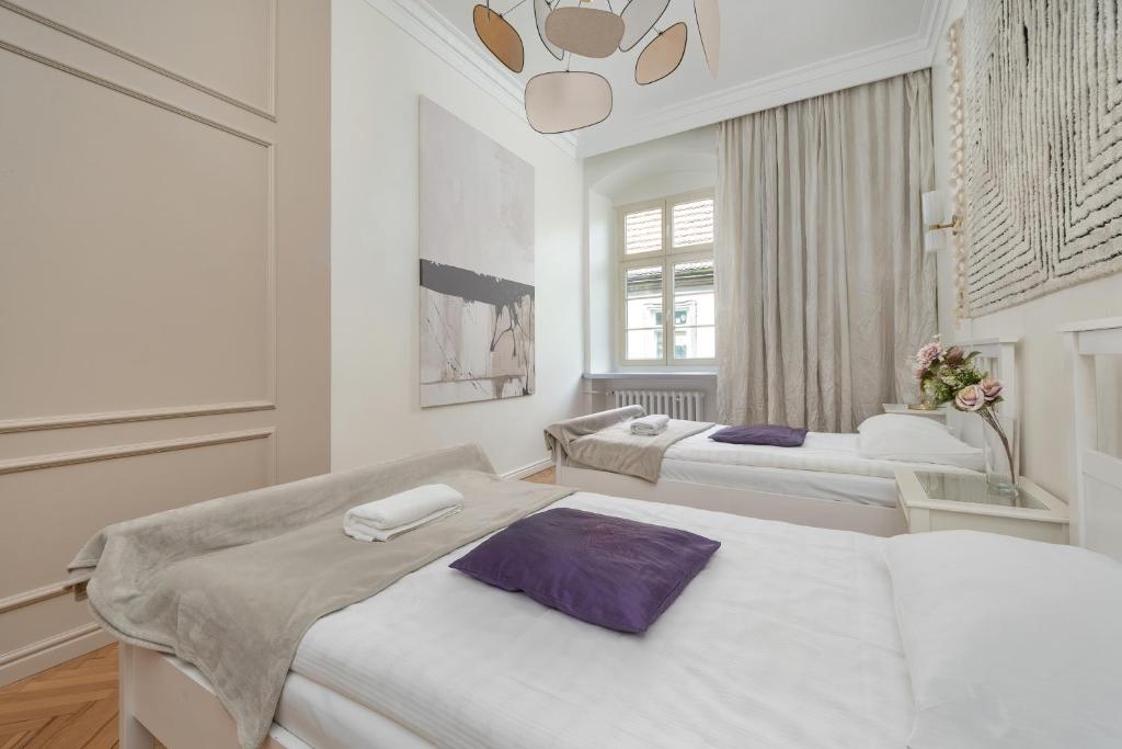 Posteľ alebo postele v izbe v ubytovaní Exclusive Old Town Apartment by Noclegi Renters