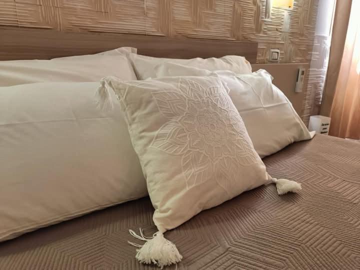 Łóżko lub łóżka w pokoju w obiekcie Casa Vacanze Fiore di Loto