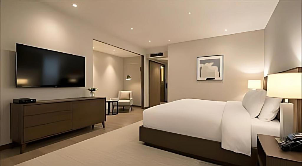 Postel nebo postele na pokoji v ubytování Hotel Happy Stay Delhi Airport