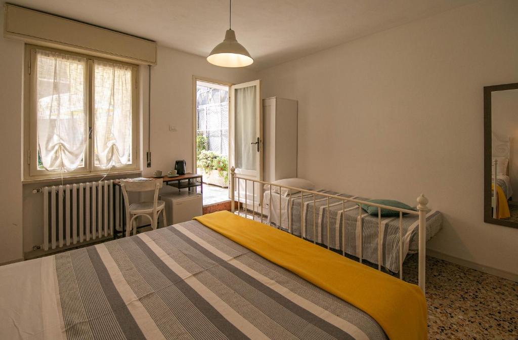 Postel nebo postele na pokoji v ubytování InGarda Rooms