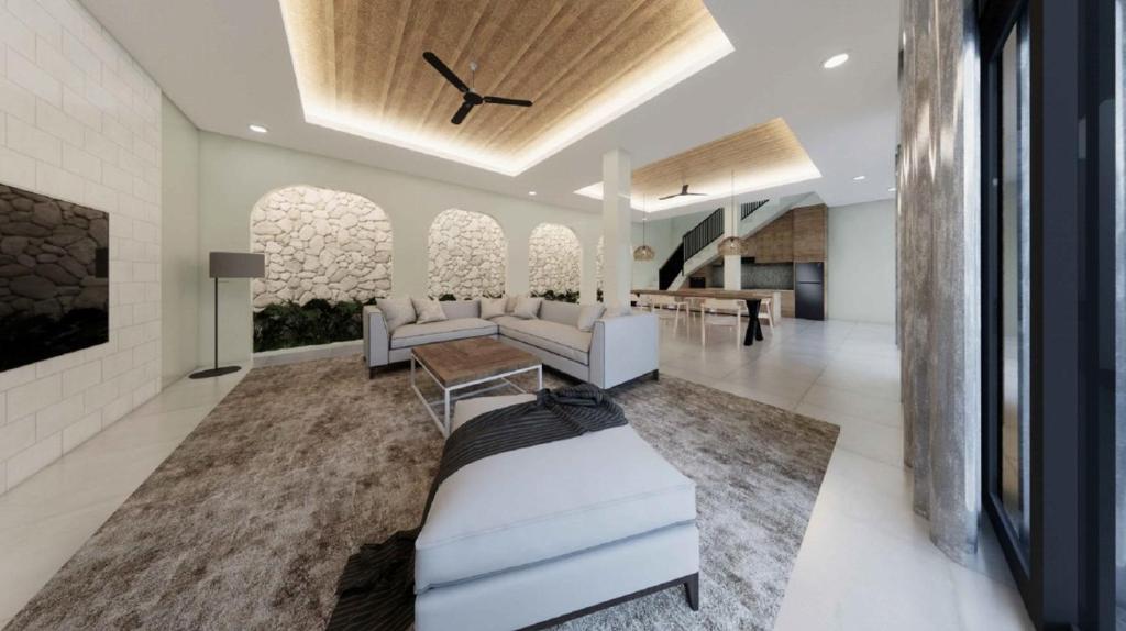 a living room with white furniture and a clock on the ceiling at Villa Sensara Sunrise Luxury 3BR in Uluwatu