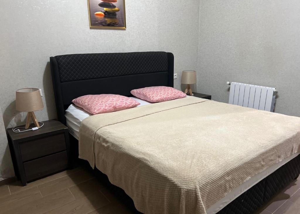 Ένα ή περισσότερα κρεβάτια σε δωμάτιο στο City Center Comfortable Room
