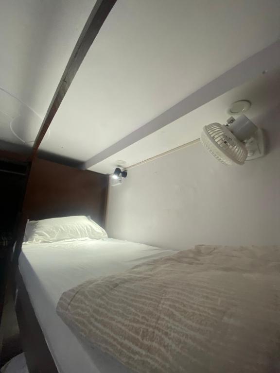 Ένα ή περισσότερα κρεβάτια σε δωμάτιο στο New Frezon hostel