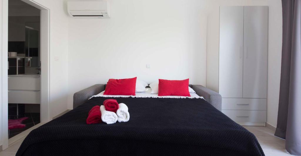 Postel nebo postele na pokoji v ubytování Apartments Filipeti