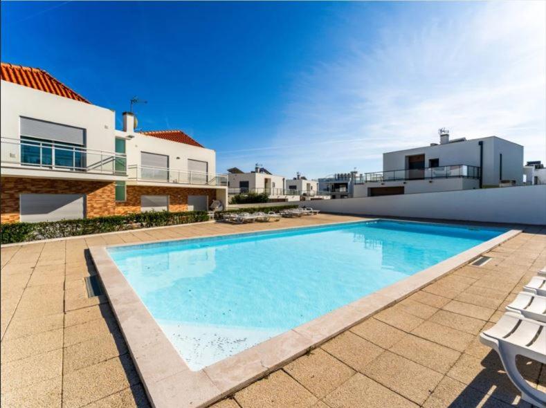 a large swimming pool in front of a house at G at Bela Baia Salir in Salir de Porto