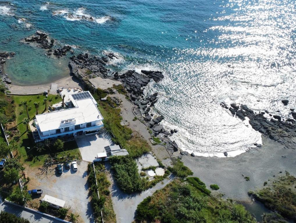 an aerial view of a house next to the ocean at Coral in Frangokastello