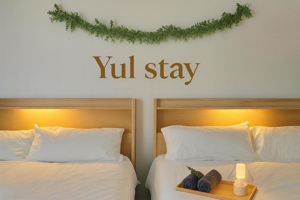 a sign that reads youll stay above two beds at Yul Stay in Seoul