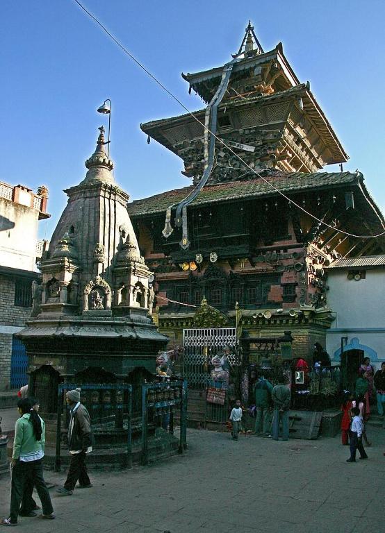a group of people walking in front of a building at Kathmandu Family Home in Kirtipur