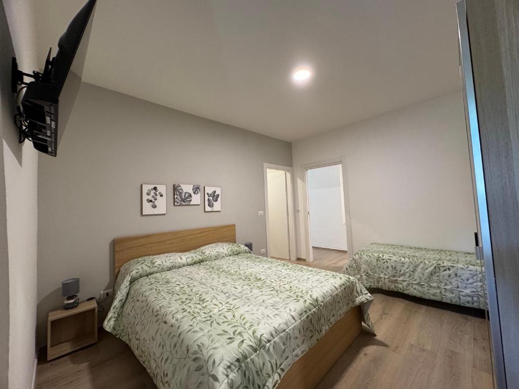 Postel nebo postele na pokoji v ubytování Cassandra Rooms