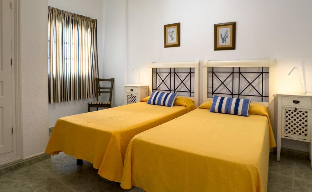 Ένα ή περισσότερα κρεβάτια σε δωμάτιο στο EMMA - Los Cristianos