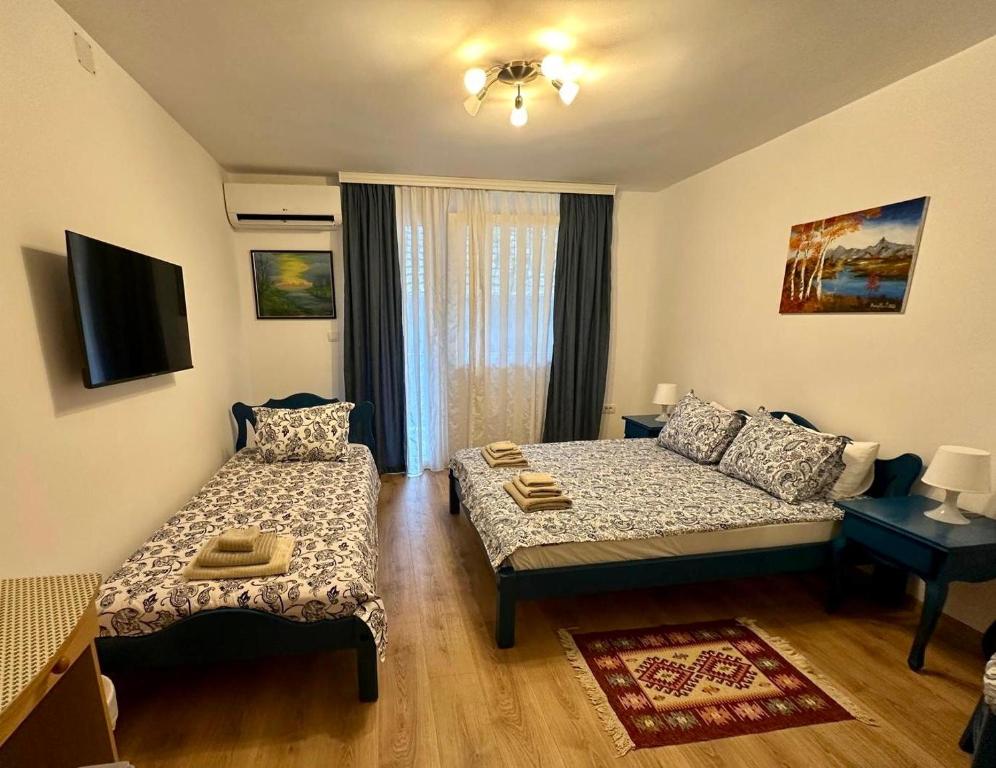 Ліжко або ліжка в номері Kruna Palića