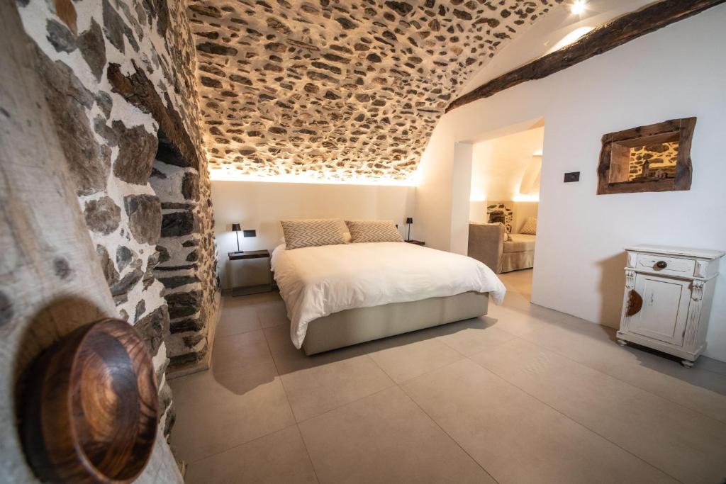 Ένα ή περισσότερα κρεβάτια σε δωμάτιο στο Porta Bormina Loft&Suites