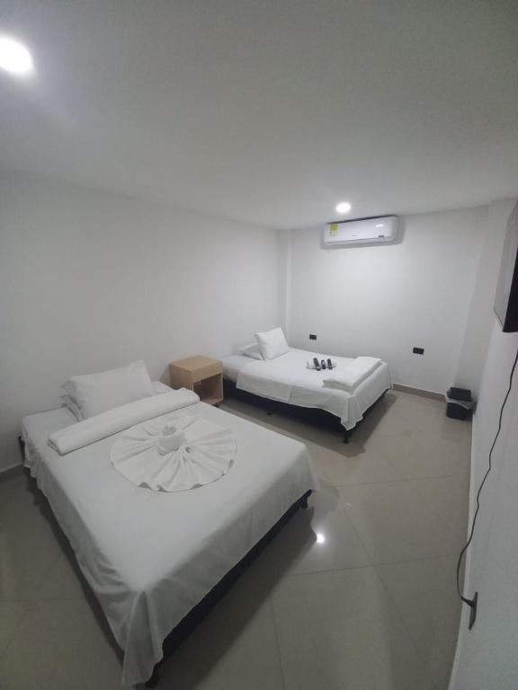 Postel nebo postele na pokoji v ubytování Hotel Centrica Del Palo 45