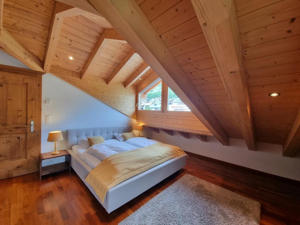 Postel nebo postele na pokoji v ubytování Penthouse Apartment Perla
