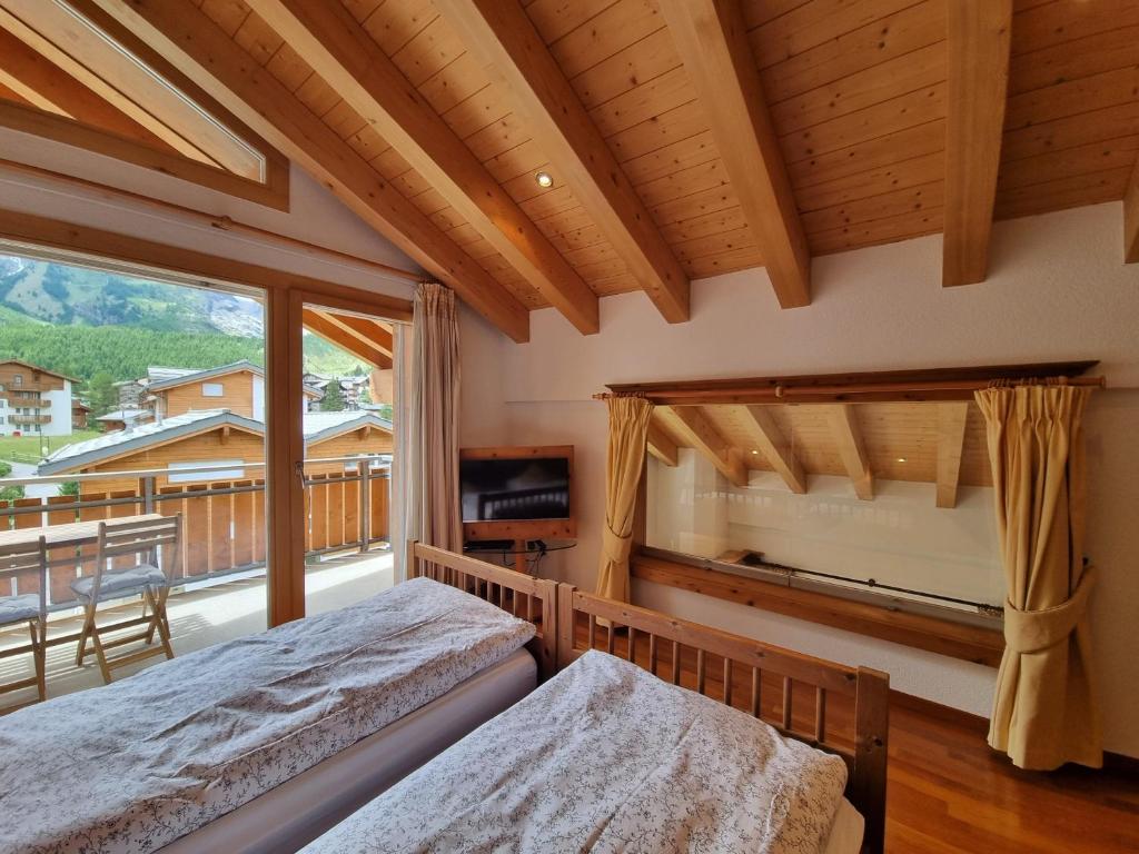Postel nebo postele na pokoji v ubytování Penthouse Apartment Perla