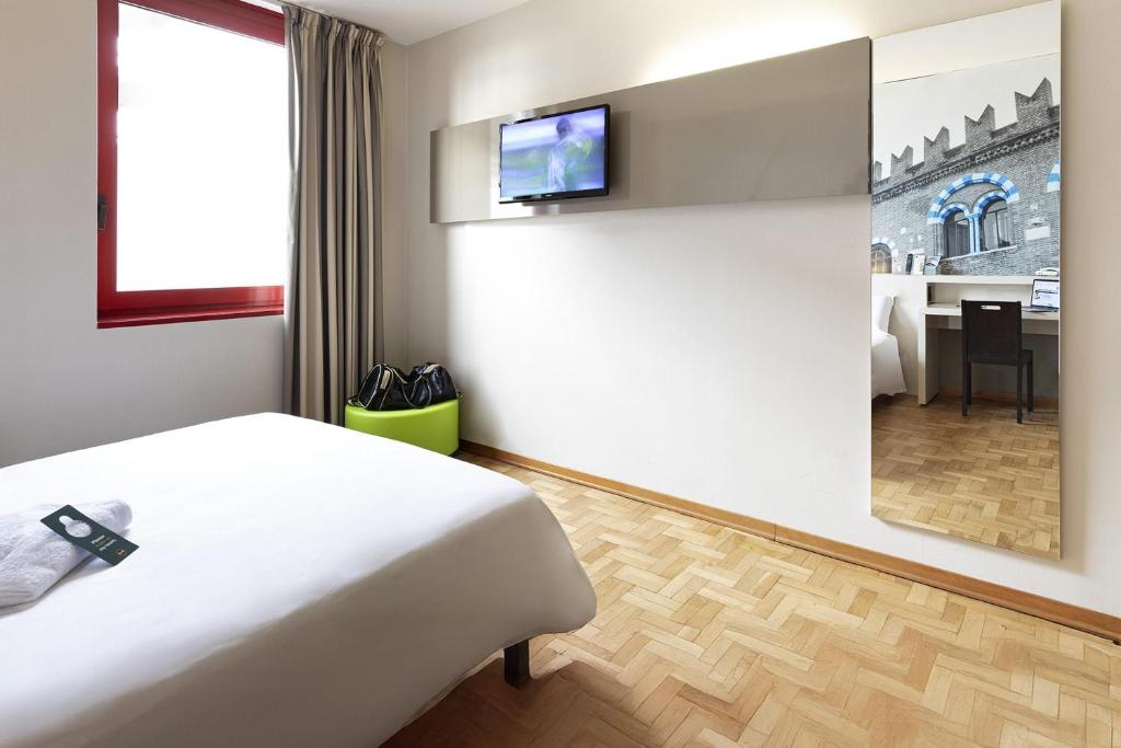 TV a/nebo společenská místnost v ubytování B&B Hotel Verona
