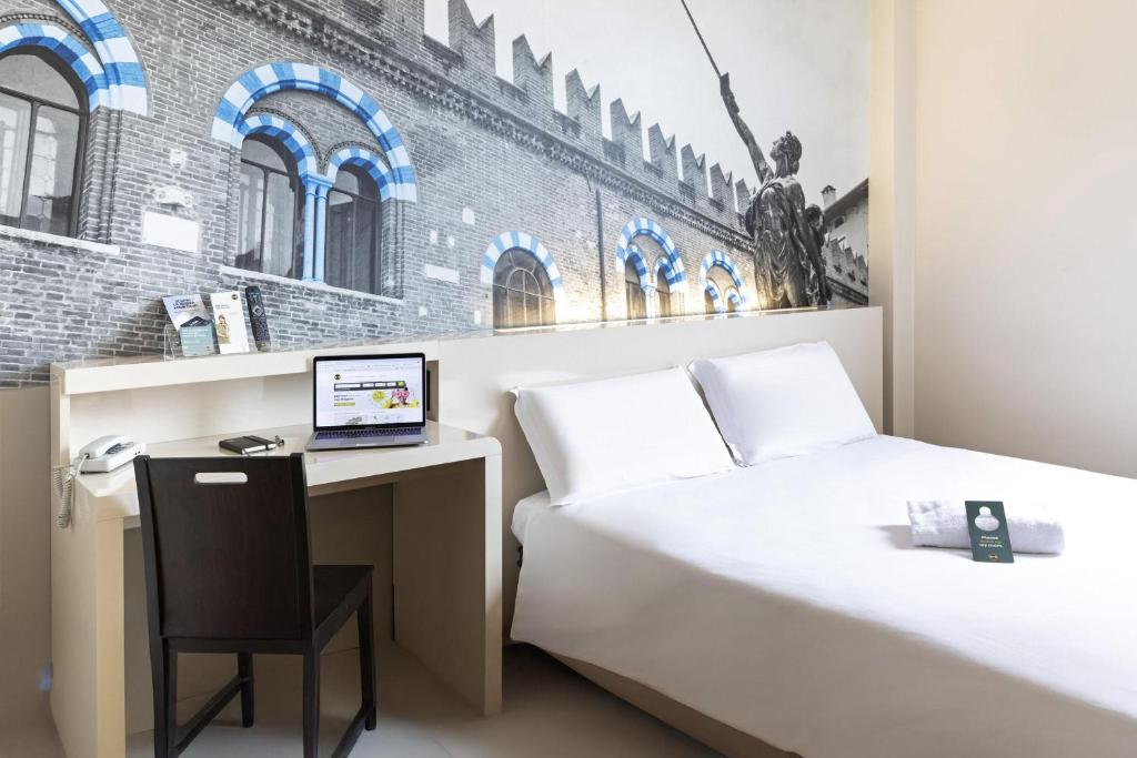 Postel nebo postele na pokoji v ubytování B&B Hotel Verona