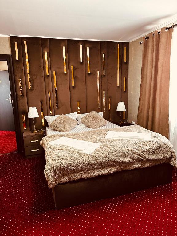Postel nebo postele na pokoji v ubytování Nowad Hotel