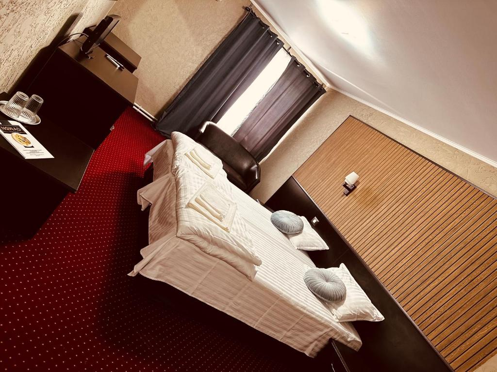 Postel nebo postele na pokoji v ubytování Nowad Hotel
