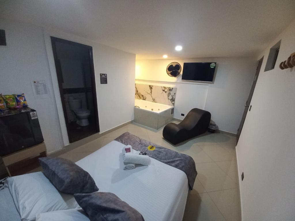 Postel nebo postele na pokoji v ubytování Hotel Centrica Del Palo 45