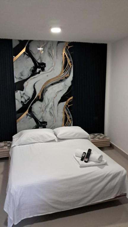 Postel nebo postele na pokoji v ubytování Hotel Centrica Del Palo 45