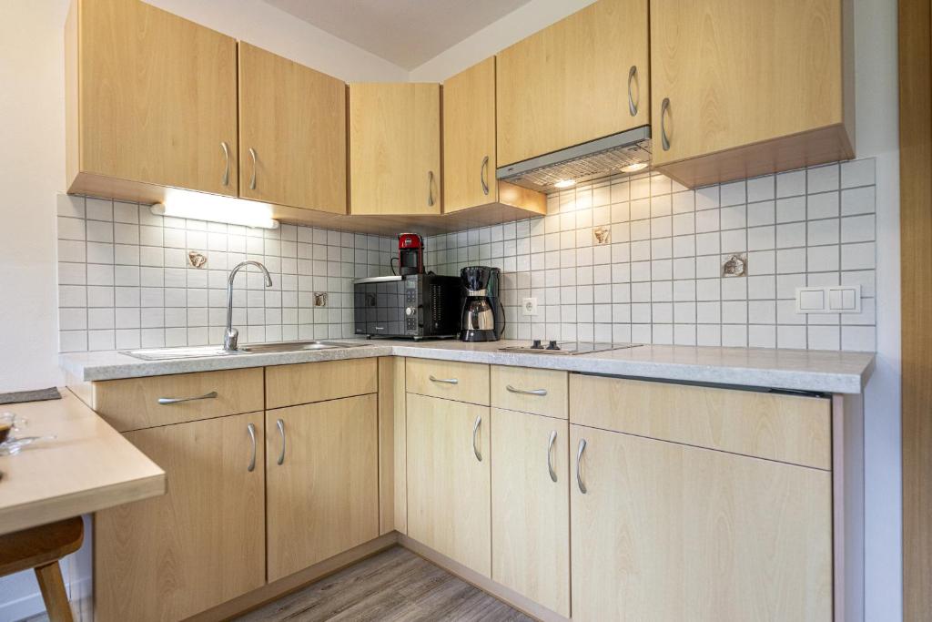 Kuchyň nebo kuchyňský kout v ubytování Apartments Woerndle