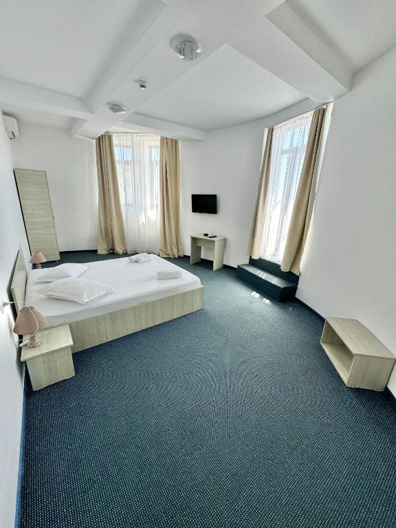 Postel nebo postele na pokoji v ubytování Neptun Resort