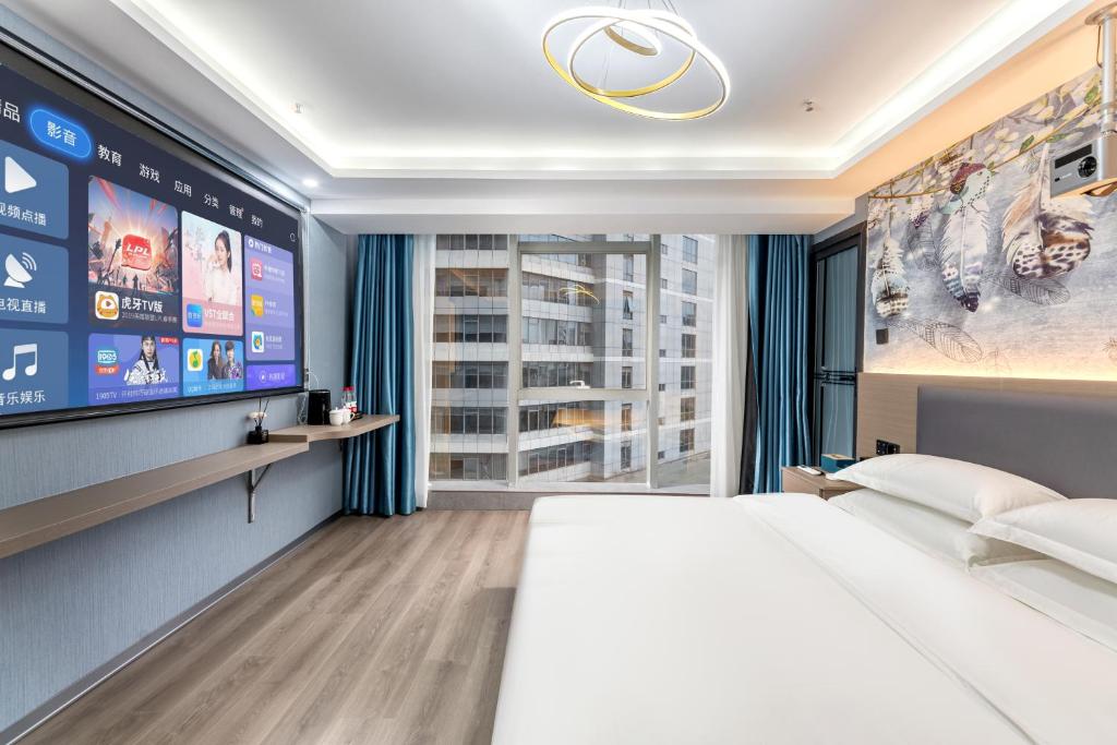 Postel nebo postele na pokoji v ubytování Lilang International Apartment-Guangzhou Pazhou Exhibition Center Branch