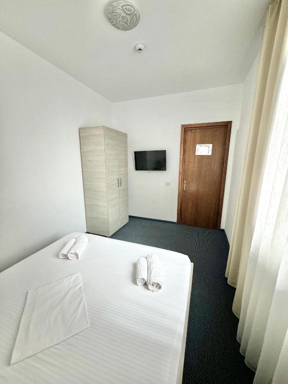 Postel nebo postele na pokoji v ubytování Neptun Resort